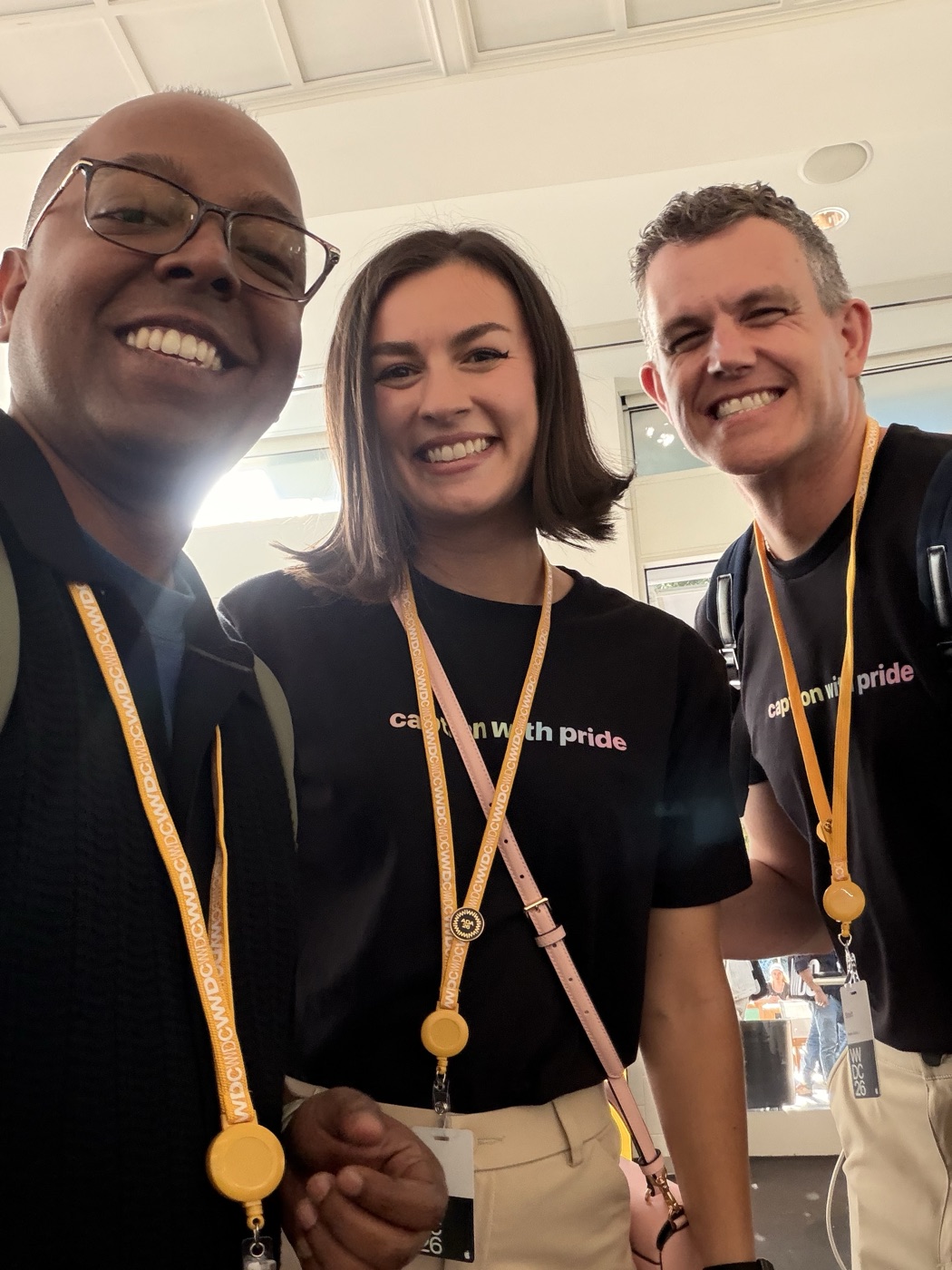 Lilly with the Inclusivity winner and Scott, all wearing caption with pride shirts