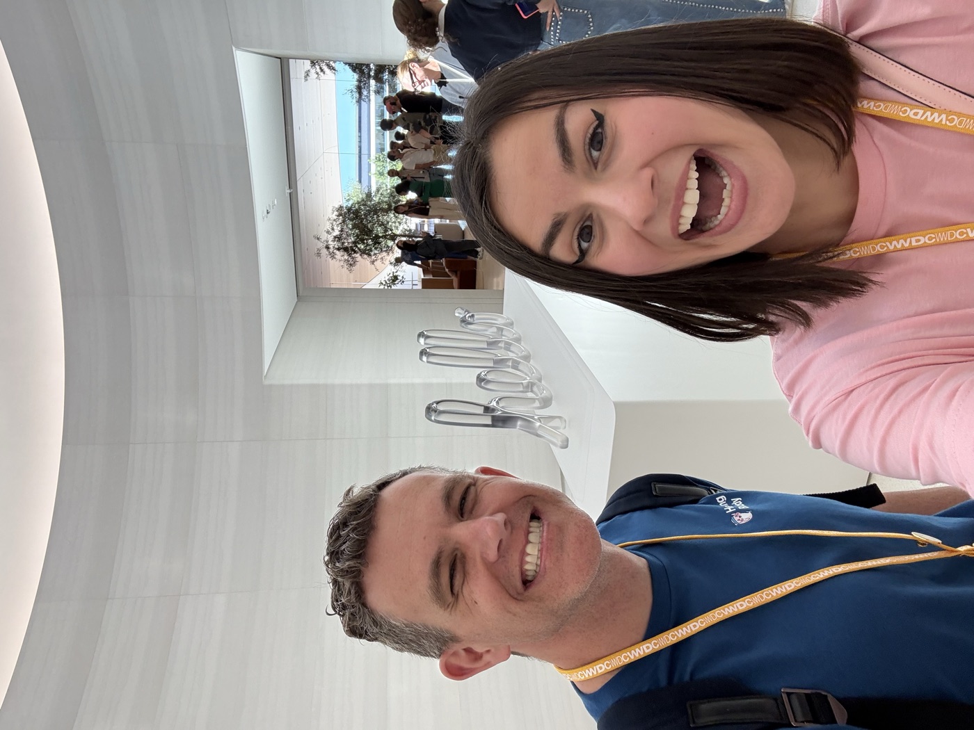 Lilly and Scott in front of the hello sculpture inside the Observatory at Apple Park
